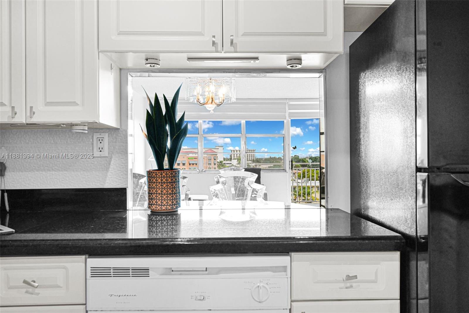 2100 Sans Souci Boulevard, Unit A509 North Miami, FL 33181 - Photo 15 of 44 a kitchen with a refrigerator a oven and cabinets