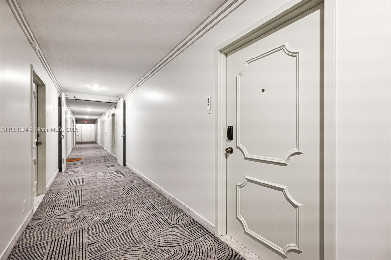2100 Sans Souci Boulevard, Unit A509 North Miami, FL 33181 - Photo 2 of 44 a view of a hallway with wooden floor