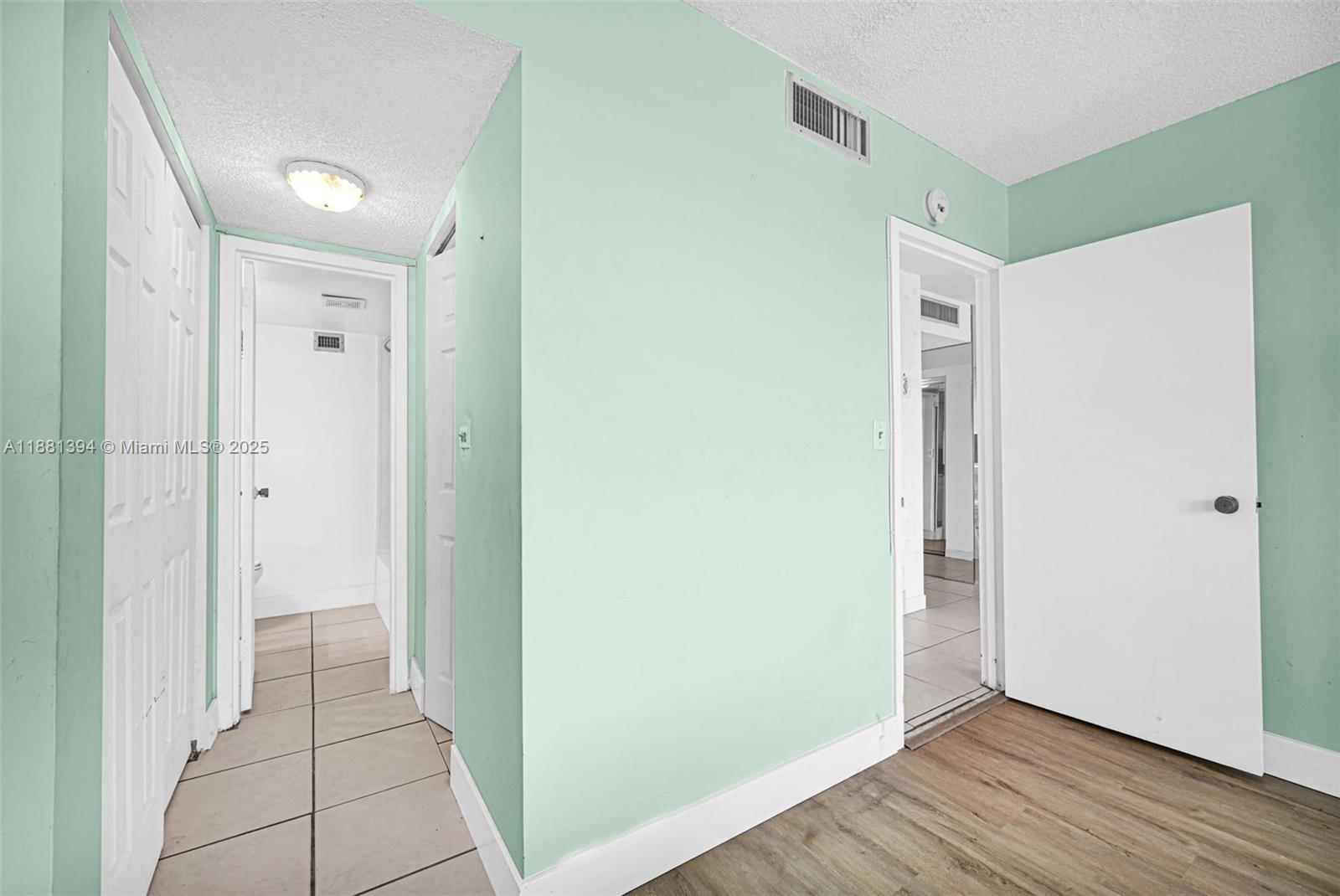 2100 Sans Souci Boulevard, Unit A509 North Miami, FL 33181 - Photo 21 of 44 a view of a hallway with wooden floor