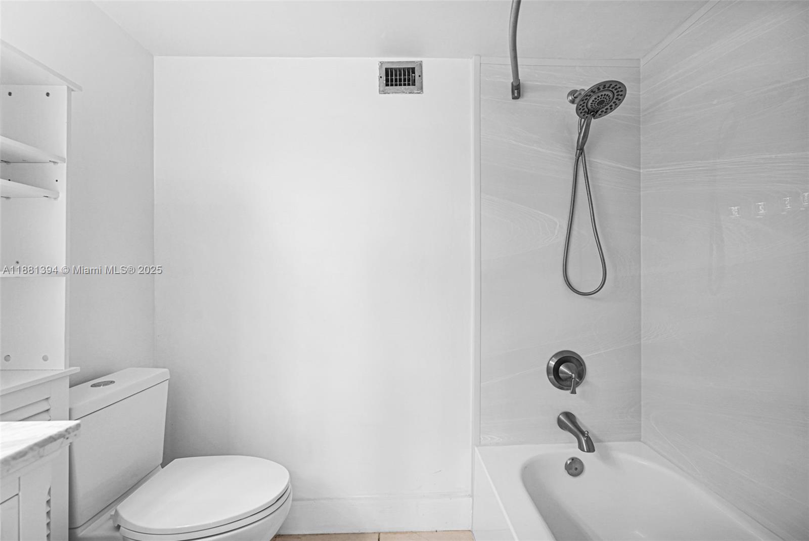 2100 Sans Souci Boulevard, Unit A509 North Miami, FL 33181 - Photo 26 of 44 a bathroom with a toilet and a tub