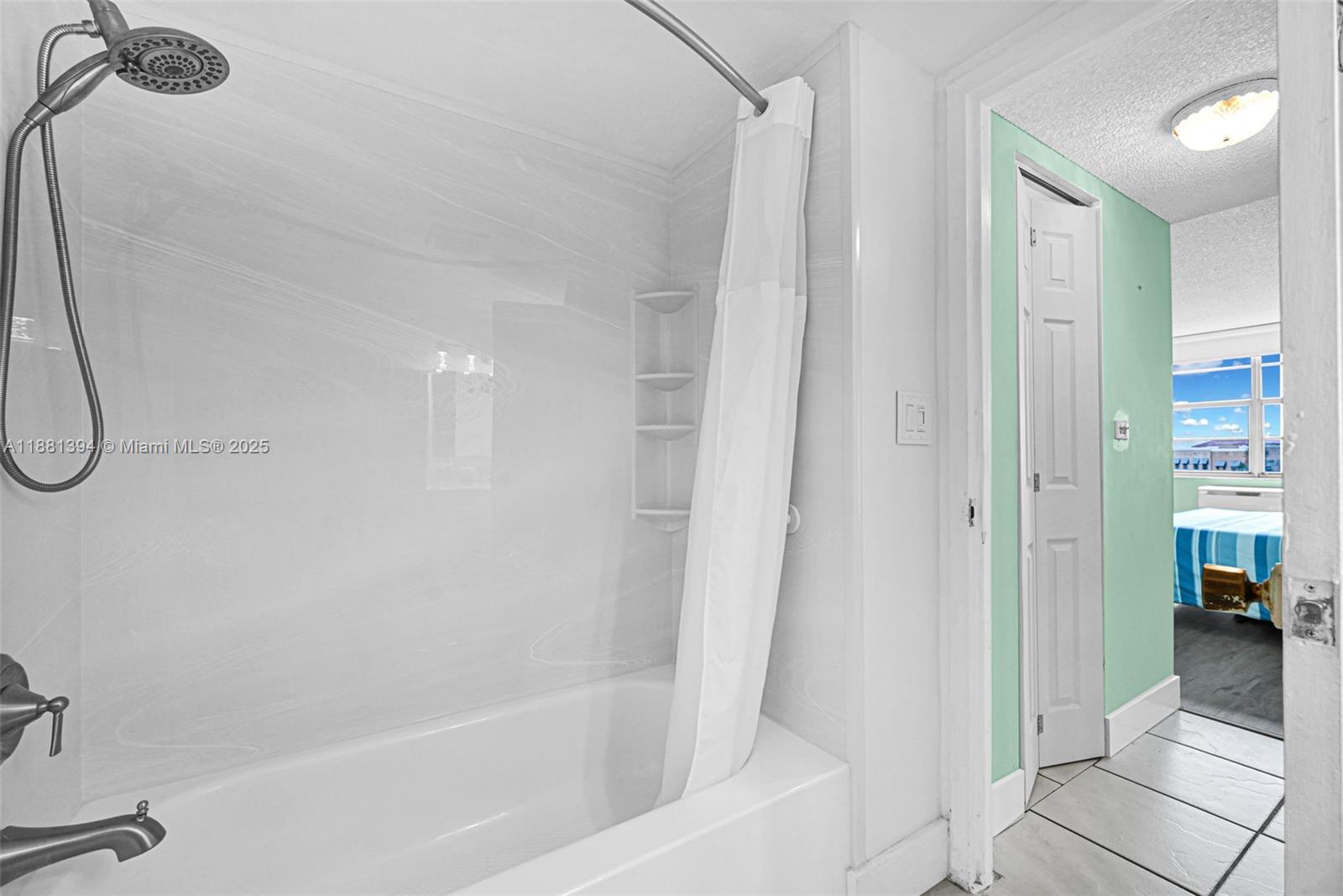 2100 Sans Souci Boulevard, Unit A509 North Miami, FL 33181 - Photo 28 of 44 a bathroom with a shower