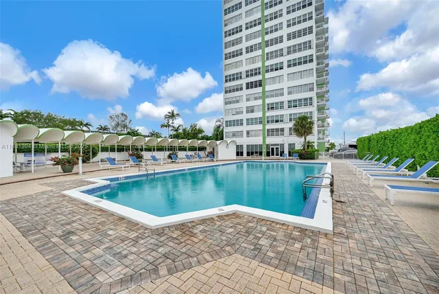 a view of a swimming pool with a lake view
