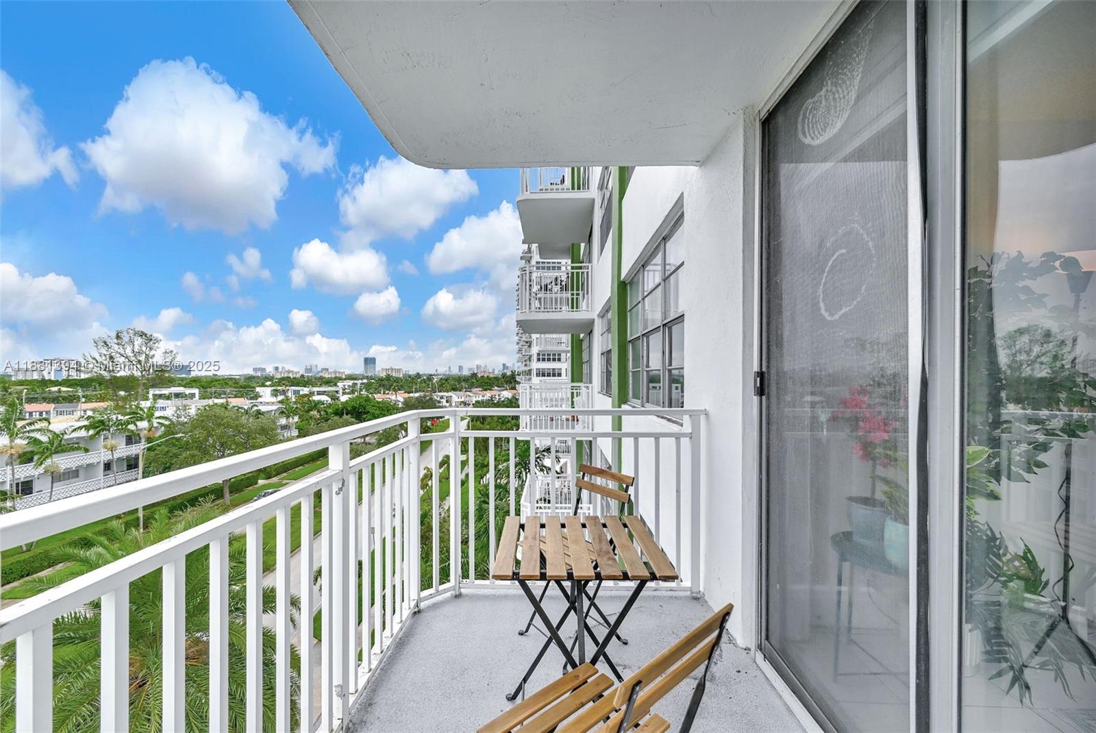 2100 Sans Souci Boulevard, Unit A509 North Miami, FL 33181 - Photo 8 of 44 a view of balcony with furniture