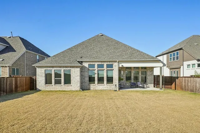 a building outdoor space with patio furniture and potted plants