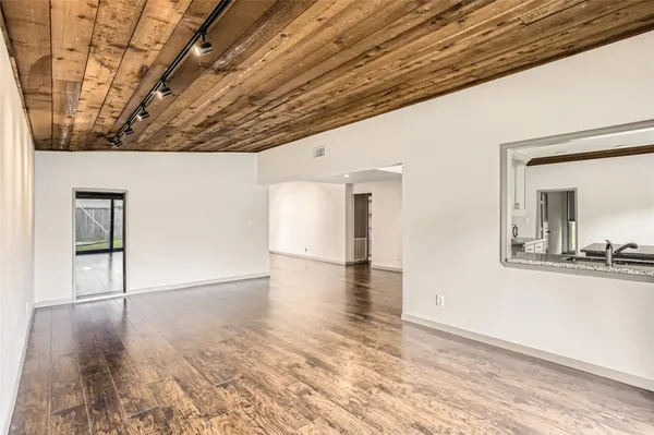 a view of a livingroom with wooden floor