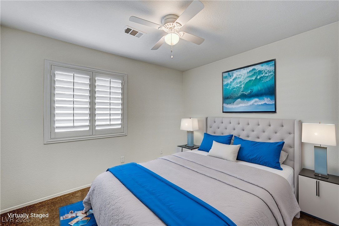 991 Ridge Path Avenue Henderson, NV 89015 - Photo 13 of 24 Carpeted bedroom featuring a ceiling fan, visible