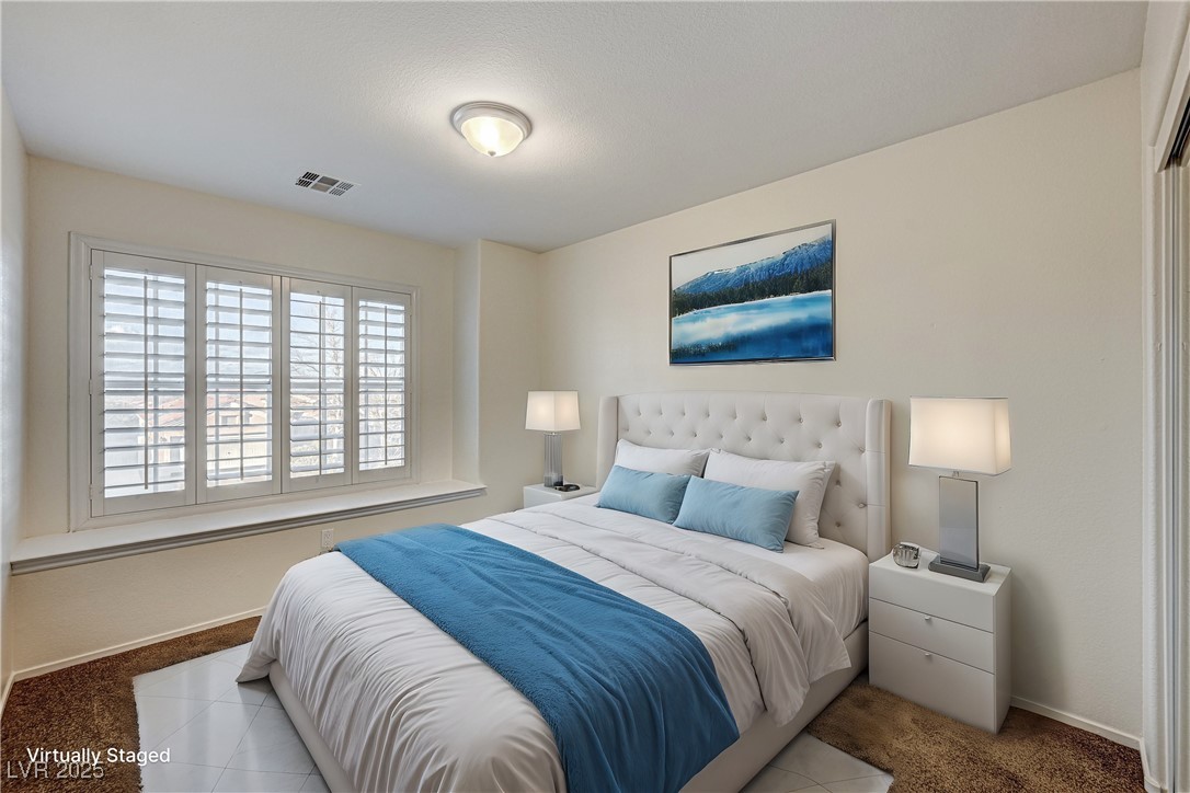 991 Ridge Path Avenue Henderson, NV 89015 - Photo 15 of 24 Bedroom with carpet floors, baseboards, and visibl