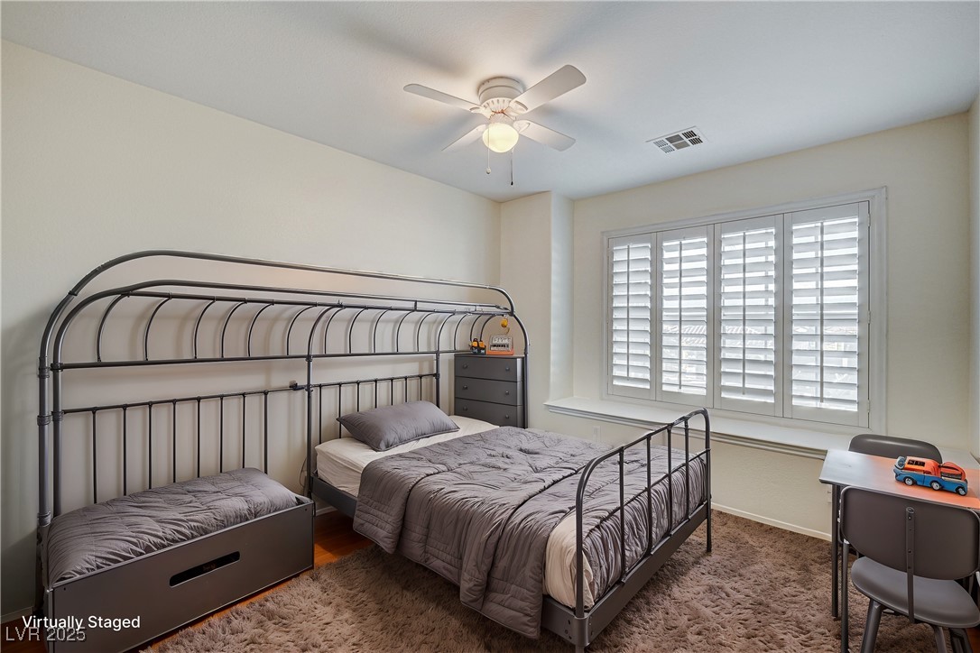 991 Ridge Path Avenue Henderson, NV 89015 - Photo 16 of 24 Bedroom featuring carpet floors, visible vents, an