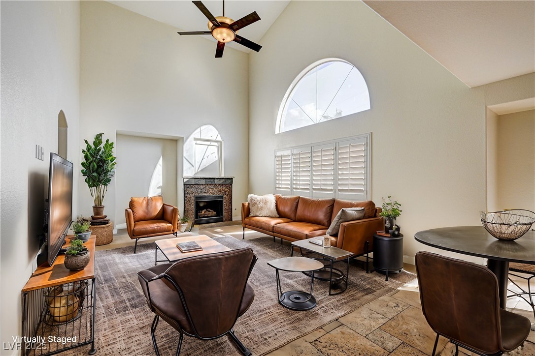 991 Ridge Path Avenue Henderson, NV 89015 - Photo 7 of 24 Living room featuring ceiling fan, high vaulted ce