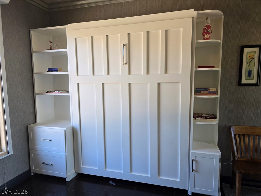 2050 West Warm Springs Road, Unit 2422 Henderson, NV 89014 - Photo 32 of 44 This flexible living space features a convenient, integrated wall bed with built-in storage solutions.