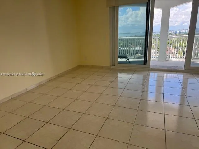 a view of an empty room and window