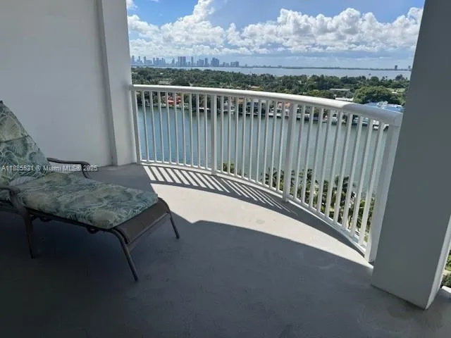 a view of a balcony with wooden floor