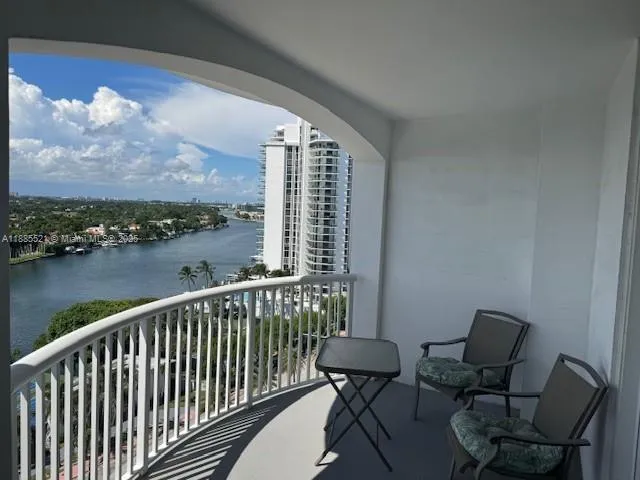 a view of a balcony with chairs