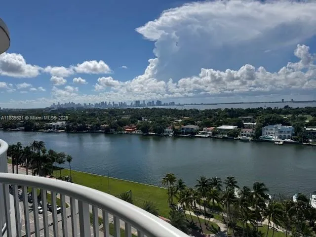 a view of a lake with a city