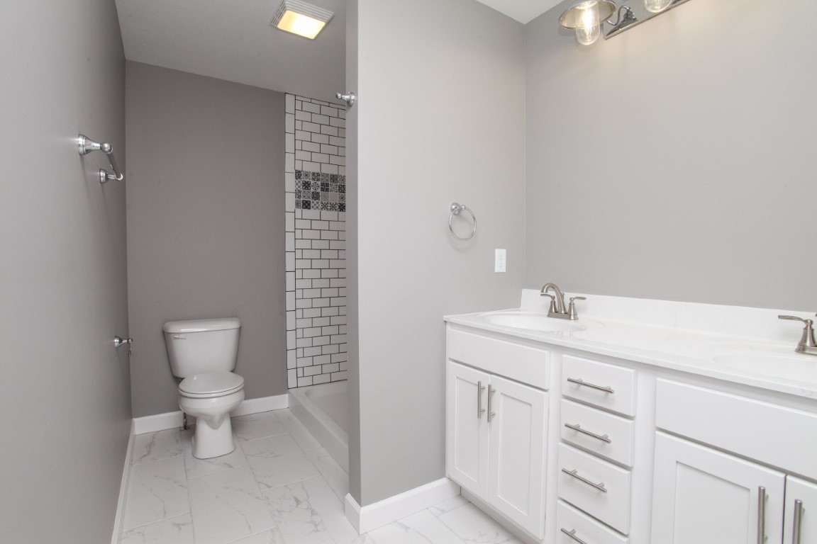 2238 Heather Ridge Drive Normal, IL 61761 - Photo 20 of 26 a bathroom with a toilet sink and mirror