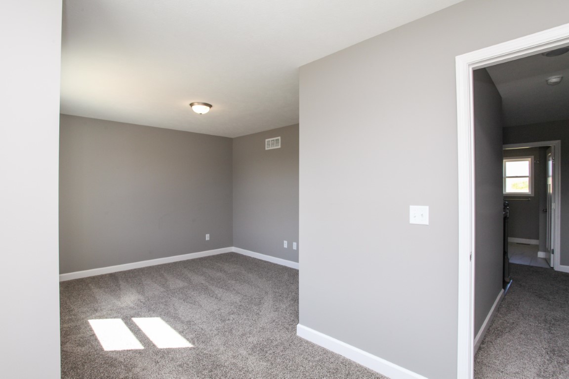 2238 Heather Ridge Drive Normal, IL 61761 - Photo 24 of 26 an empty room with windows and entrance