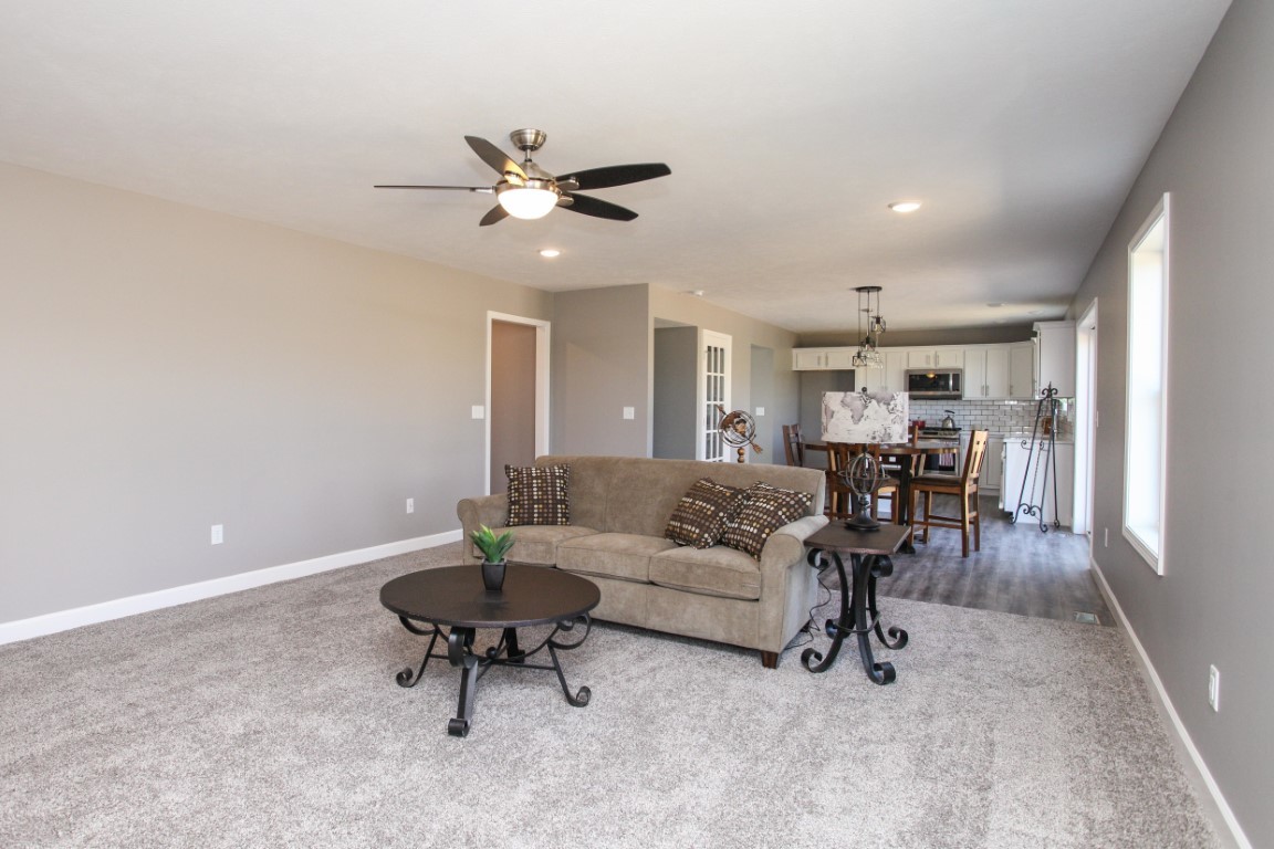 2238 Heather Ridge Drive Normal, IL 61761 - Photo 3 of 26 a living room with furniture and a dining table with rug
