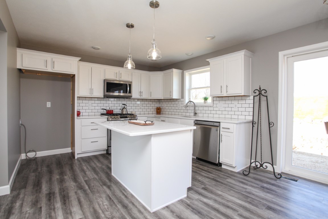 2238 Heather Ridge Drive Normal, IL 61761 - Photo 6 of 26 a kitchen with a stove a sink and a microwave