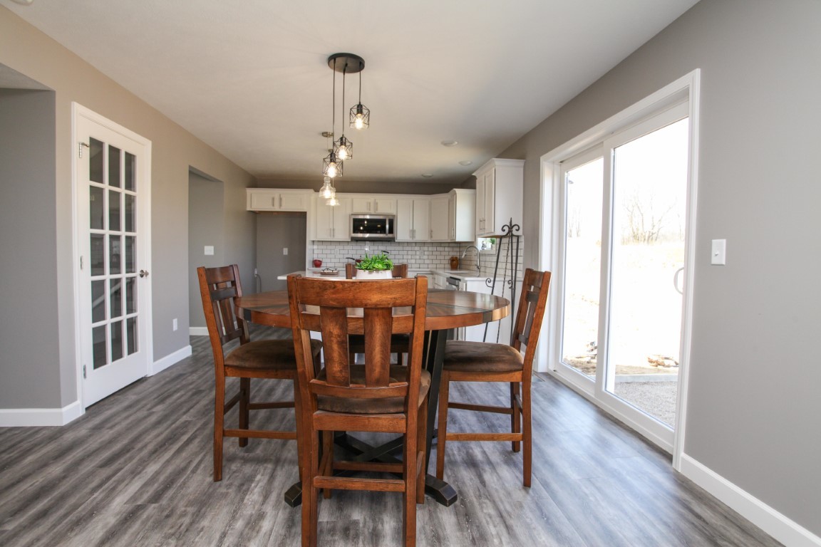 2238 Heather Ridge Drive Normal, IL 61761 - Photo 7 of 26 a view of a dining room with furniture window and wooden floor