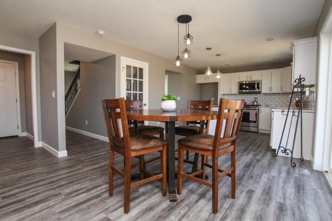2238 Heather Ridge Drive Normal, IL 61761 - Photo 9 of 26 a dining room with furniture and wooden floor