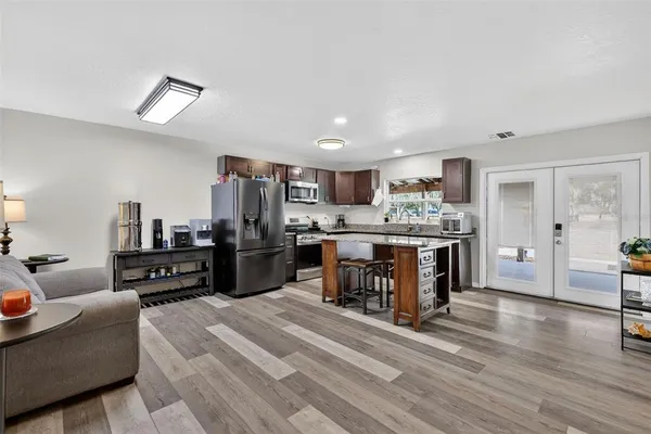 a bedroom with a bed and a ceiling fan