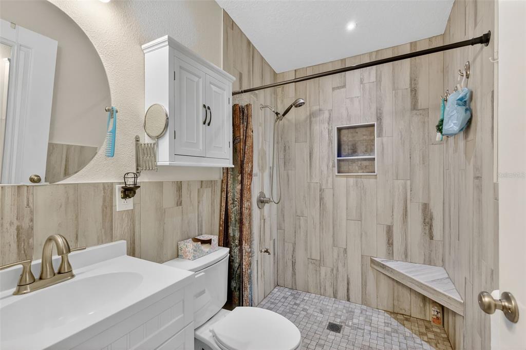 4533 Southwest 37th Terrace Bushnell, FL 33513 - Photo 25 of 58 a bathroom with a sink toilet and shower