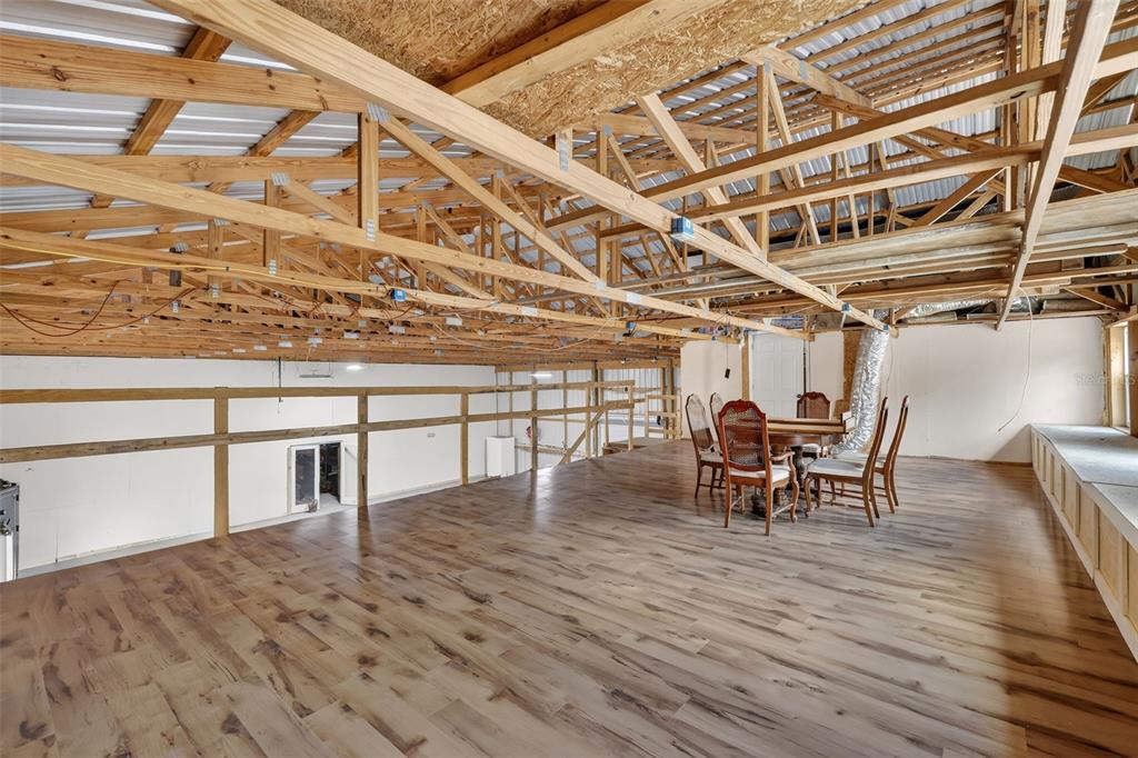 4533 Southwest 37th Terrace Bushnell, FL 33513 - Photo 29 of 58 a view of a roof deck with table and chairs