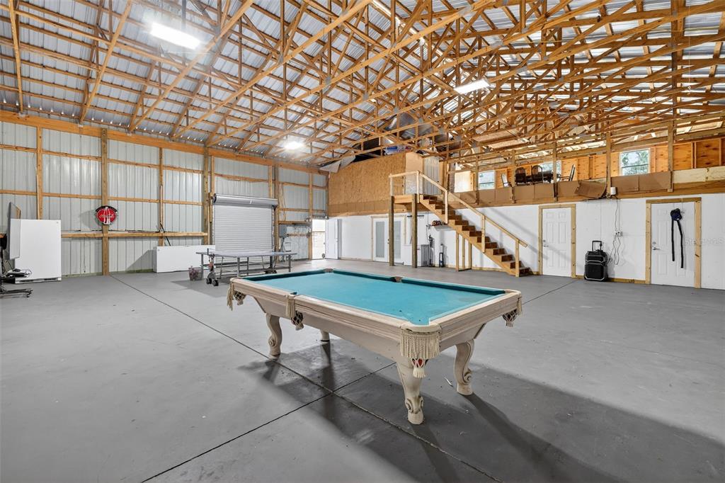 4533 Southwest 37th Terrace Bushnell, FL 33513 - Photo 31 of 58 a room with pool table and windows