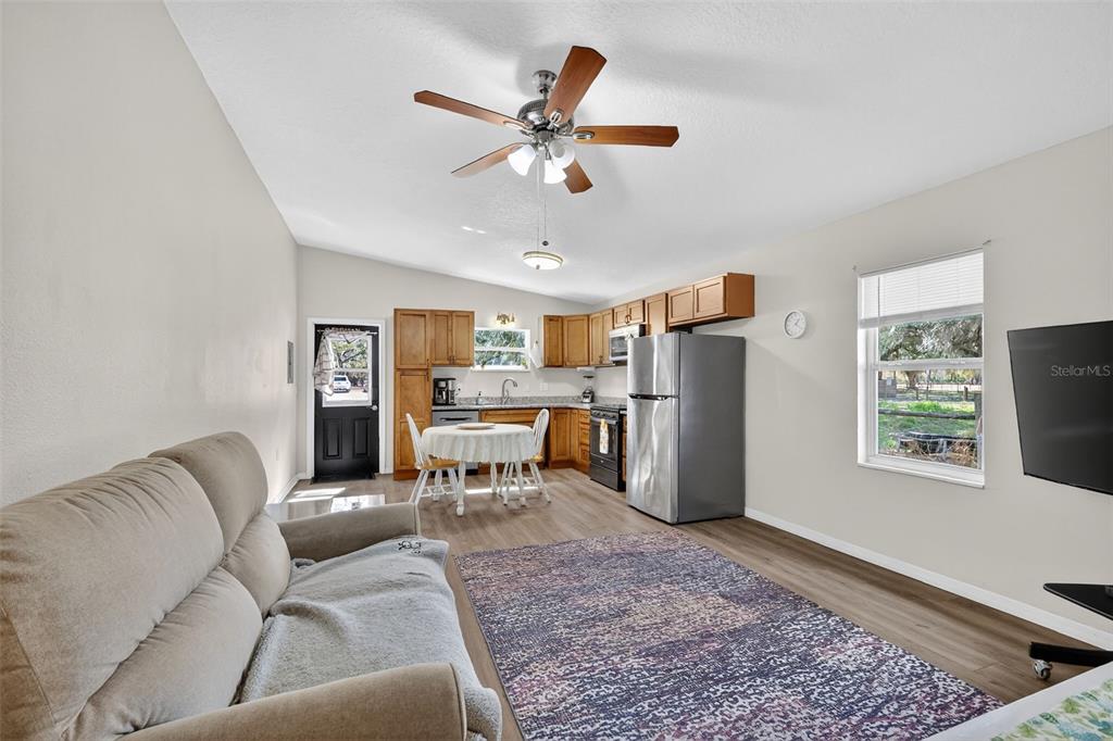 4533 Southwest 37th Terrace Bushnell, FL 33513 - Photo 35 of 58 a living room with furniture and a window
