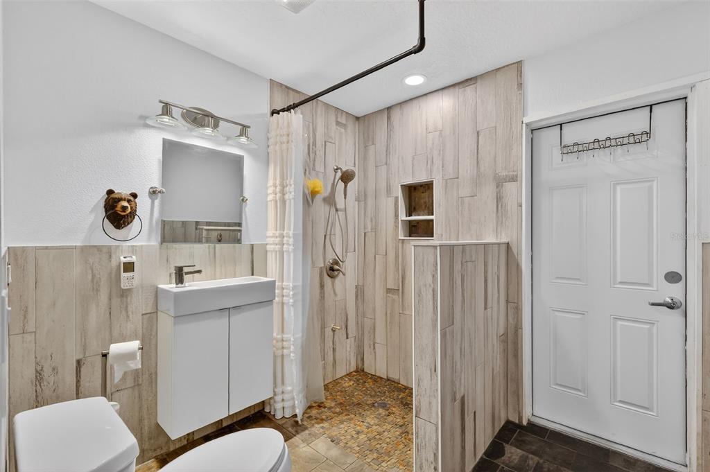 4533 Southwest 37th Terrace Bushnell, FL 33513 - Photo 41 of 58 a bathroom with a sink toilet and shower