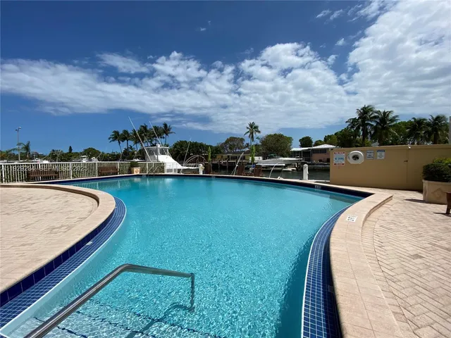 a view of a swimming pool with a lake