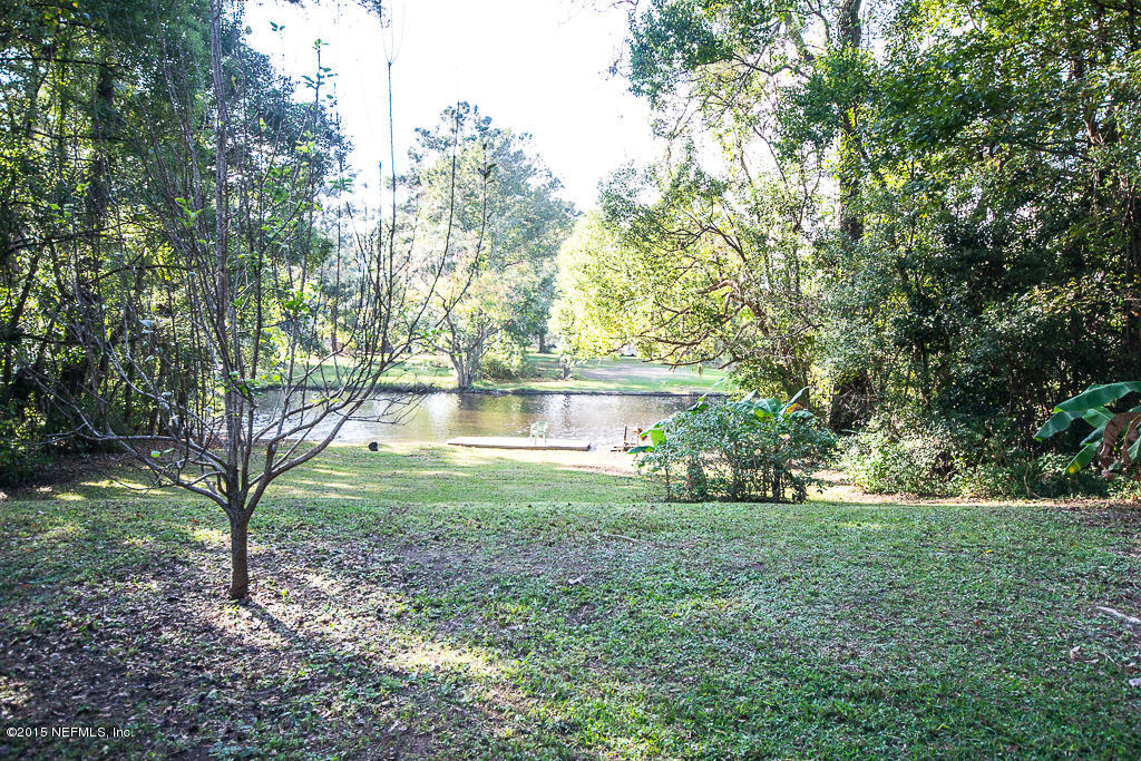 10504 Rutgers Road Jacksonville, FL 32218 - Photo 20 of 32 a view of a house with a yard