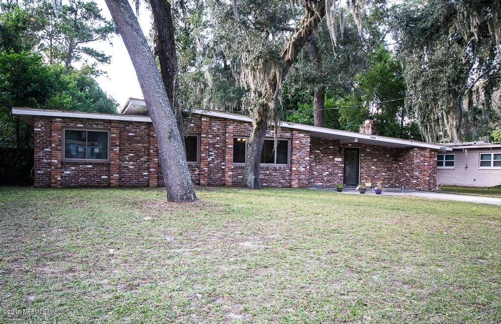 10504 Rutgers Road Jacksonville, FL 32218 - Photo 3 of 32 front view of a house with a big yard