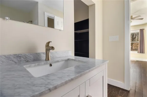 a kitchen with a sink and a granite counter tops