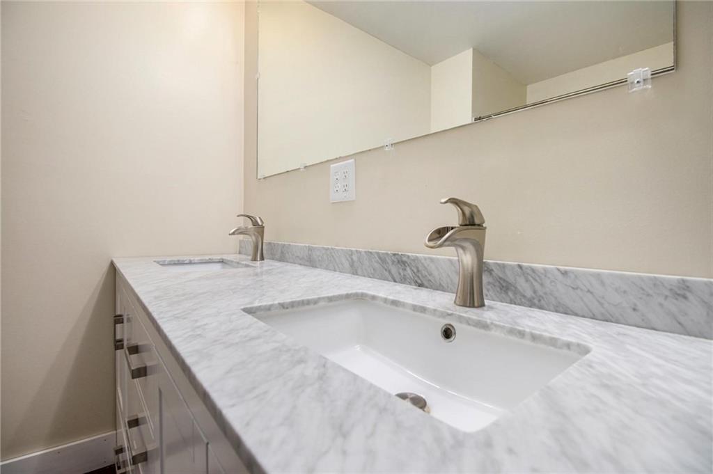 1585 Golden Pond Road Buchanan, GA 30113 - Photo 15 of 30 a bathroom with a sink and vanity