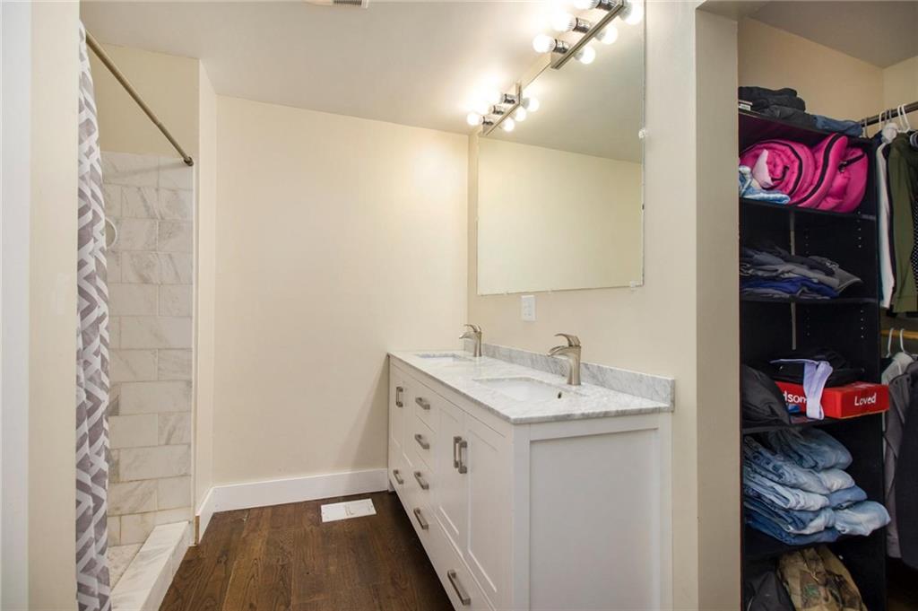 1585 Golden Pond Road Buchanan, GA 30113 - Photo 16 of 30 a bathroom with a sink and a mirror
