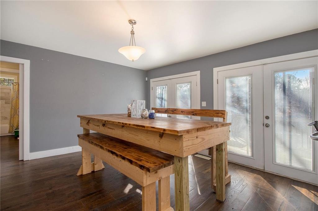 1585 Golden Pond Road Buchanan, GA 30113 - Photo 17 of 30 a view of a kitchen area with furniture and wooden floor
