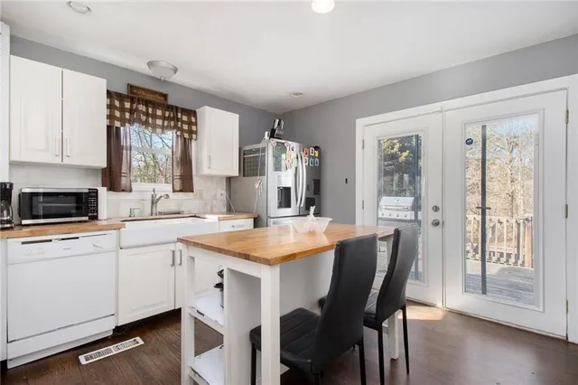 a view of a kitchen with a sink and a microwave