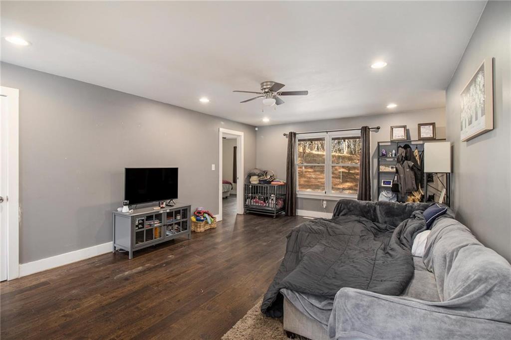 1585 Golden Pond Road Buchanan, GA 30113 - Photo 7 of 30 a living room with furniture and a flat screen tv