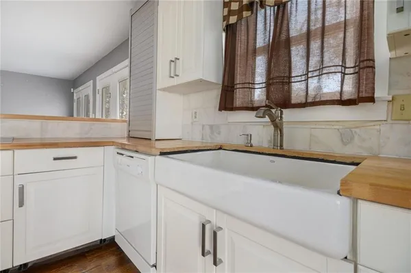 a kitchen with a sink and cabinets