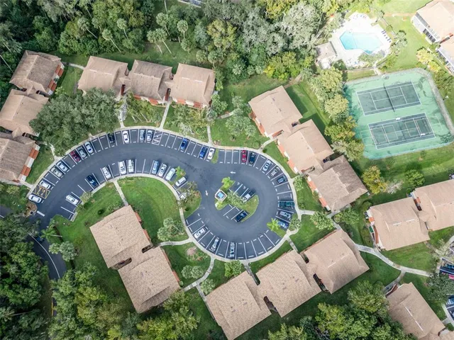 an aerial view of a house with outdoor space and street view