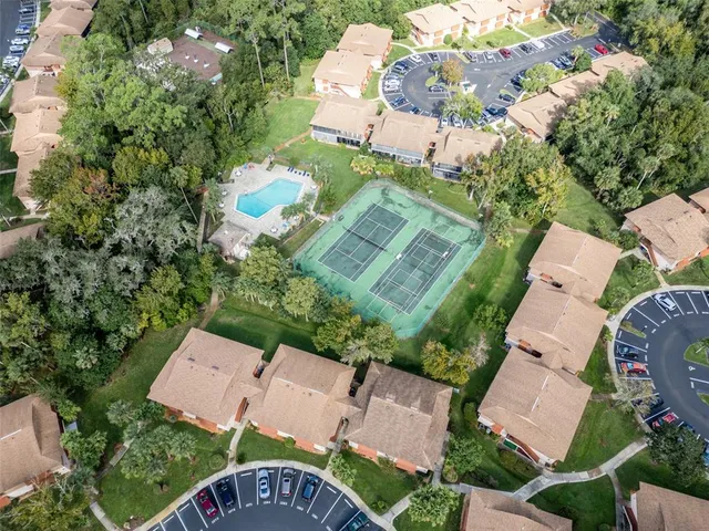 an aerial view of a house with outdoor space and street view