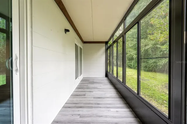 a view of gallery with wooden floor