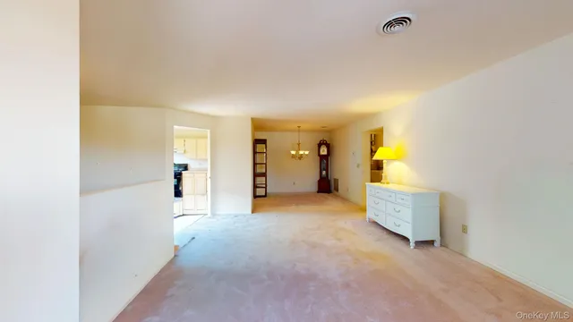 a view of a dining room with furniture wooden floor and chandelier