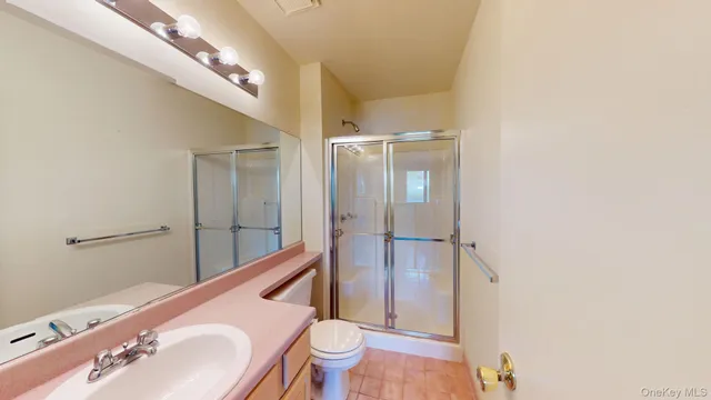 a bathroom with a sink double vanity and a mirror