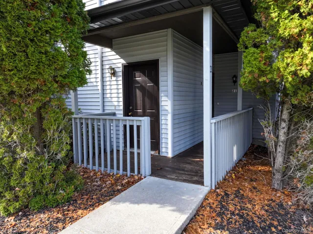 a view of a wooden fence next to a yard