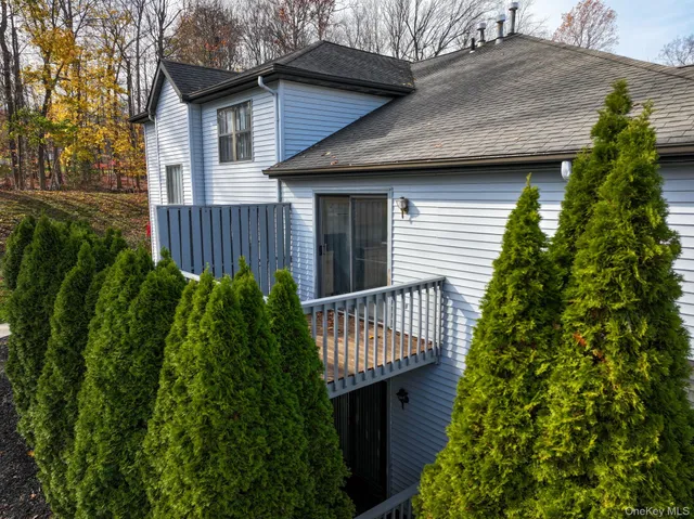 a view of a hallway view with floor to ceiling window and dining room