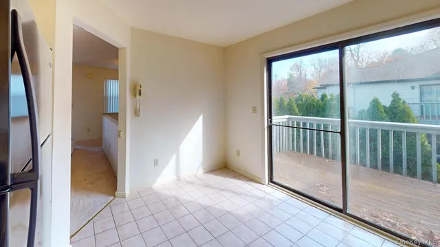 a kitchen with a stove top oven and cabinets