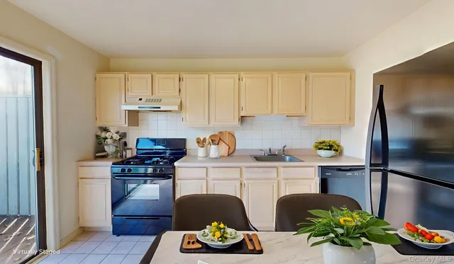 a kitchen with a table and chairs