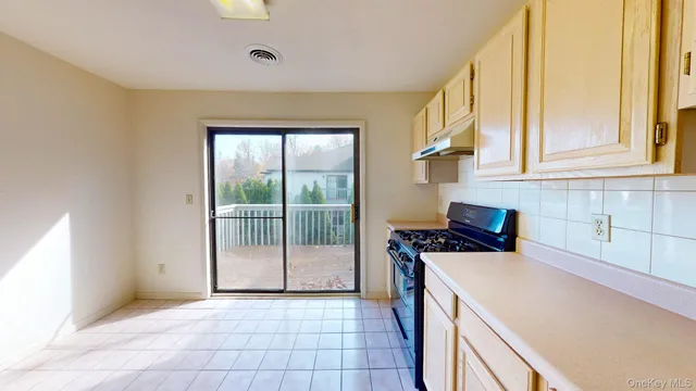 a view of a room with a sink and cabinet